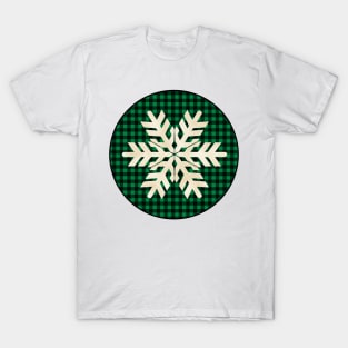 Snowflake silhouette over a black and green tile pattern T-Shirt